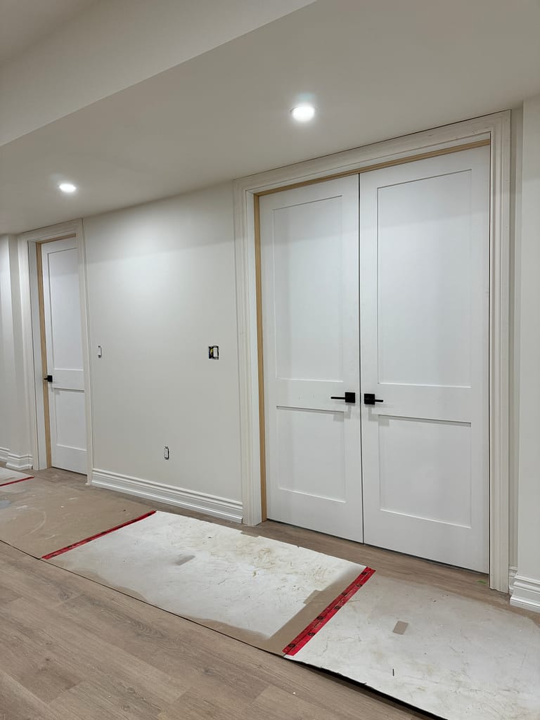 Interior doors and trim installed by a finish carpenter in Oakville home basement