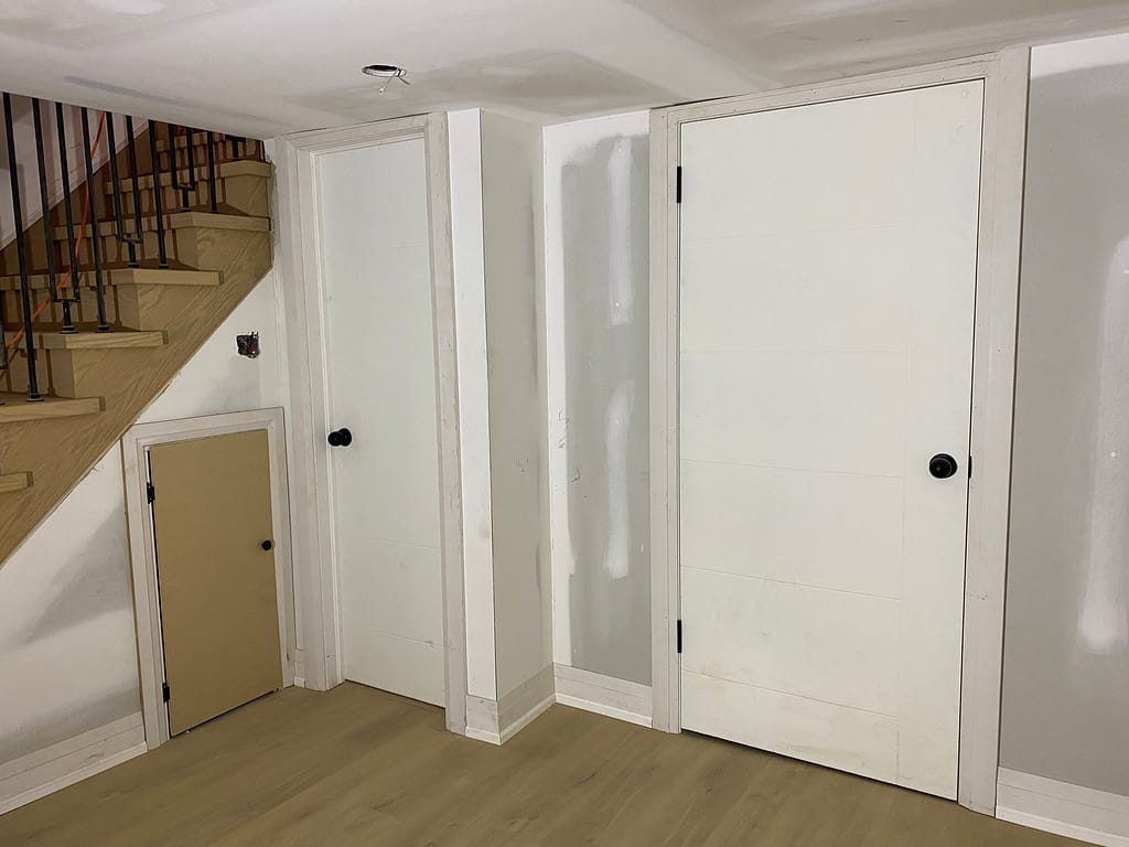 Resized interior doors installed with customized jams and casings for plaster wall in an old Toronto house