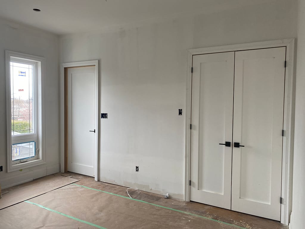 Interior door and double closet door installation in an Oakville custom home