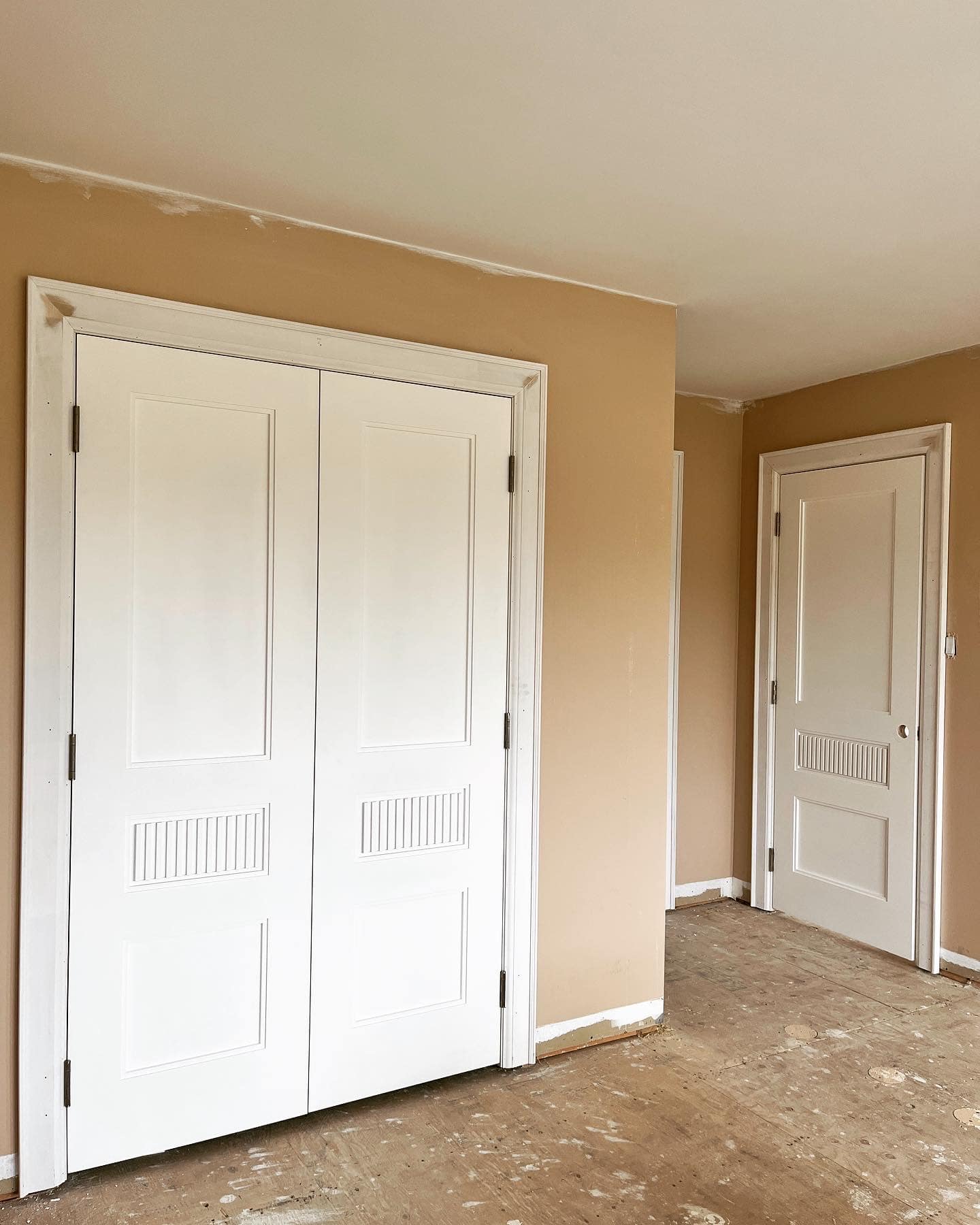 White double closet doors and interior room door installed with matching casing in a Vaughan home