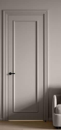 Interior designer inspiration photo showing a tall custom interior door with long panel molding detail.