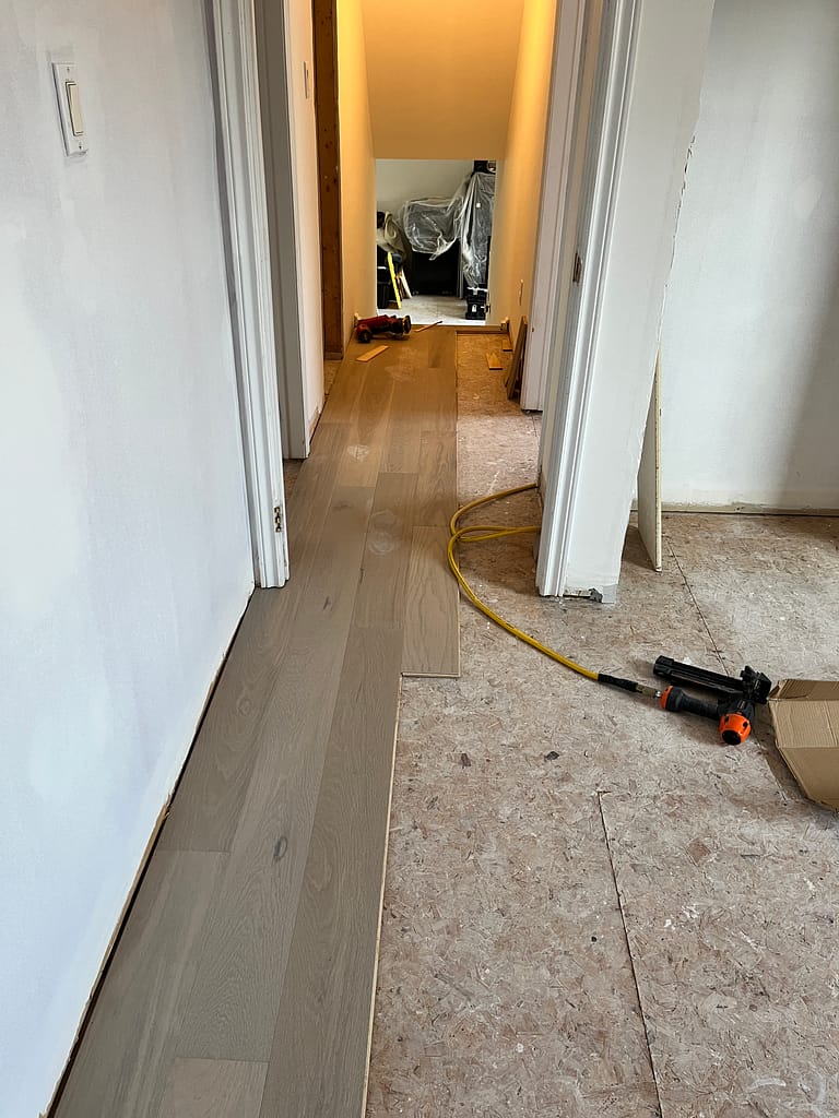Engineered hardwood flooring installation process by a finish carpenter
