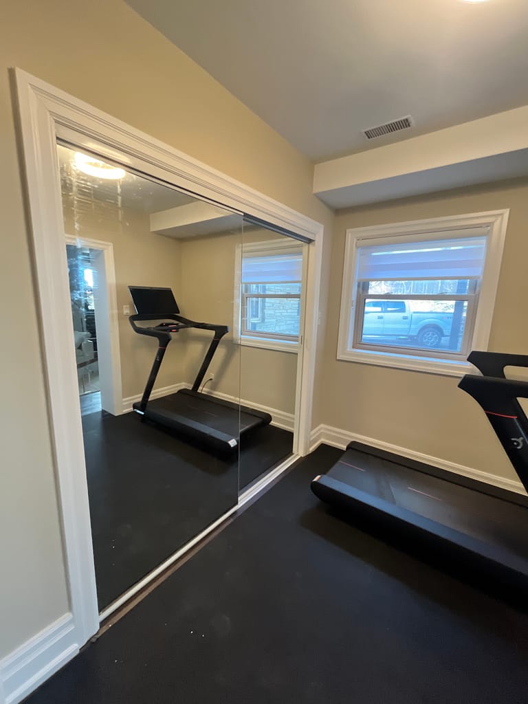Finished closet door installation for a clean bedroom interior