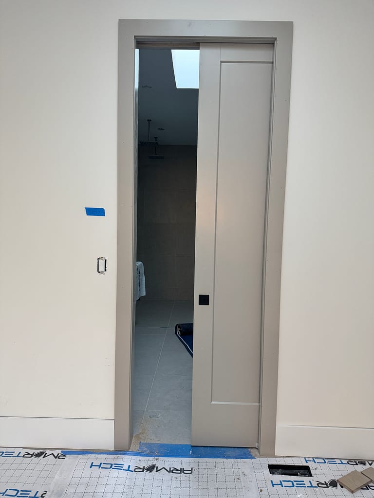 Pocket door opening finished with clean casing and trim