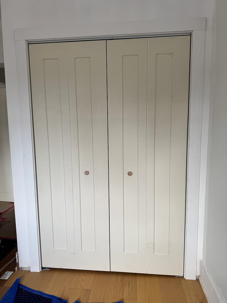 Sliding closet door track installed with precise clearance