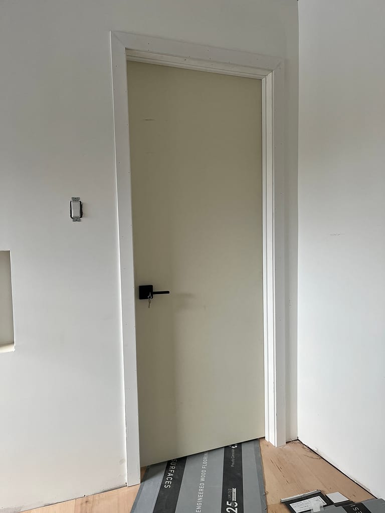 Close up of tight miter joints on modern door casing profiles installed by finish carpenter Jack Ozer in Oakville.