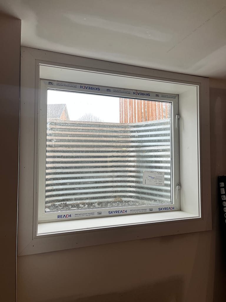 New window extension and trim installed by finish carpenter in Milton basement
