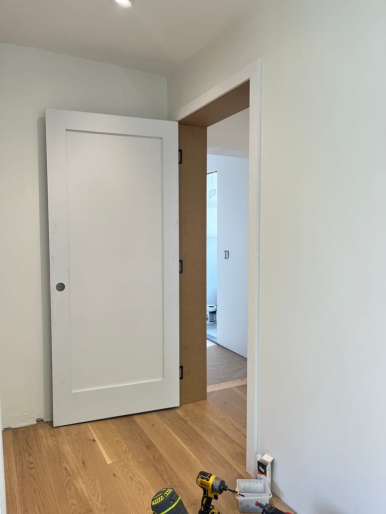White door and customized jamb installed by finish carpenter Jack in a Mississauga house.