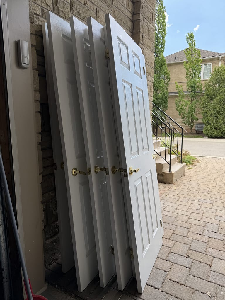 Old six-pabel hollow core doors removed by finish carpenter Jack in an Oakville home
