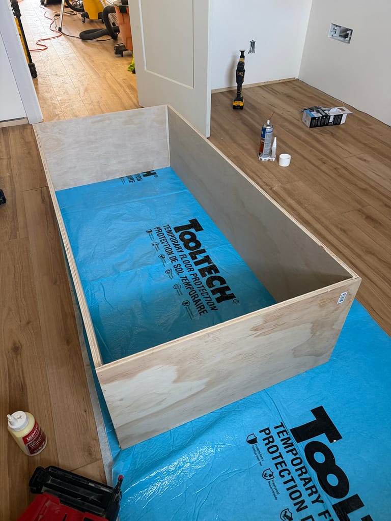 Deep plywood window jamb extension assembled on the attic floor in Kitchener