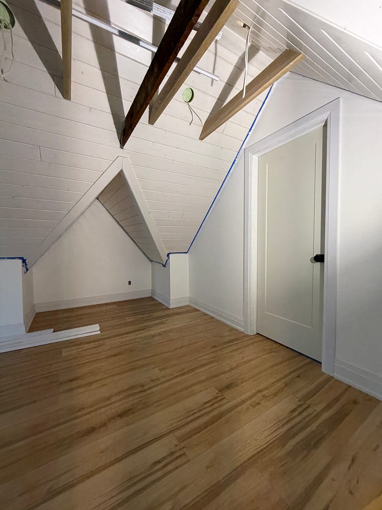 Kitchener attic with an installed interior door, casing, baseboards and shoe moulding