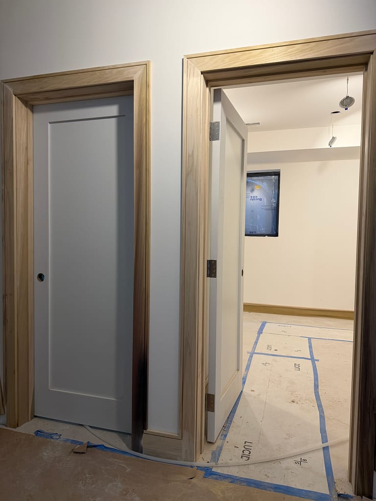 Painted interior doors with natural wood casing in a Toronto home