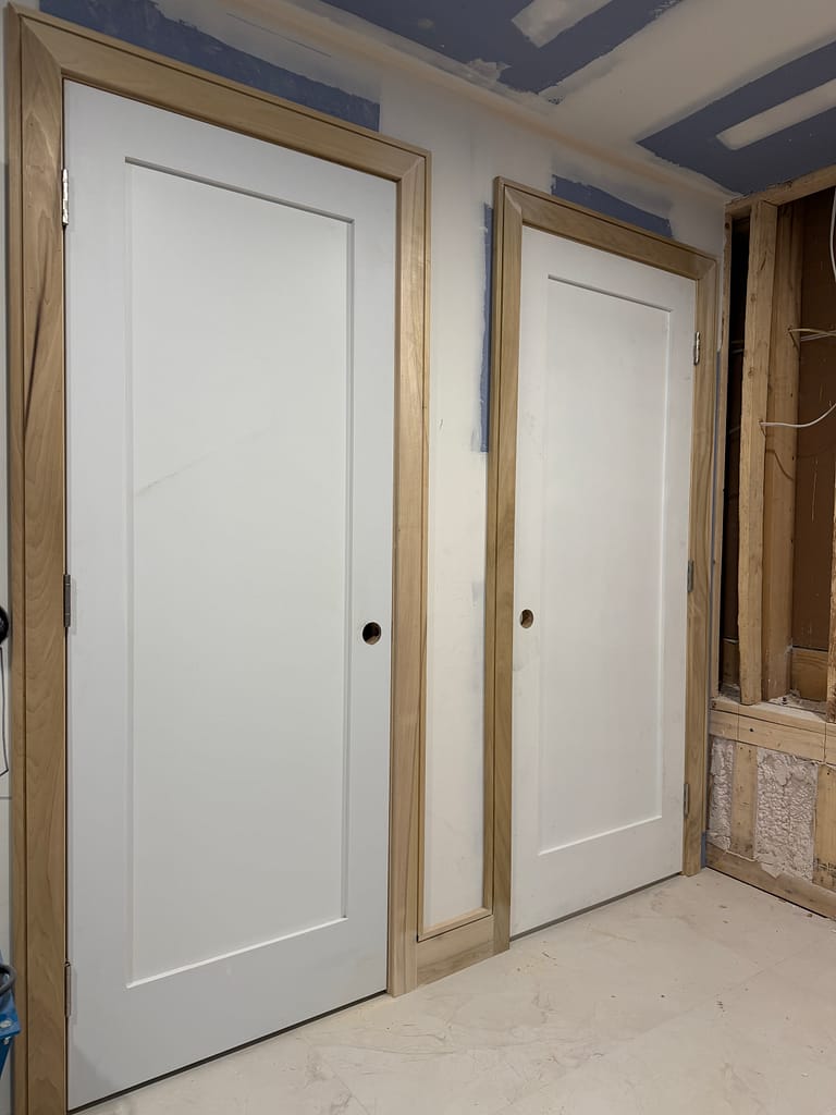Basement interior doors with custom channel casing and baseboards in Toronto