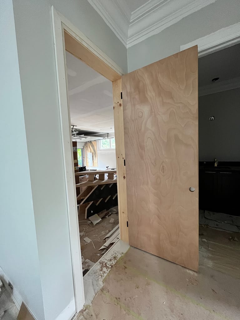 Fire-rated garage door installed in an Oakville home with the door open showing the jamb and casing.