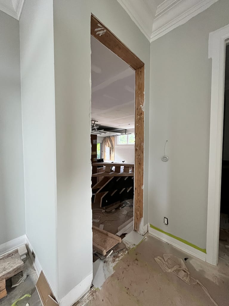 Garage entry opening prepared for a fire-rated door installation in an Oakville home.