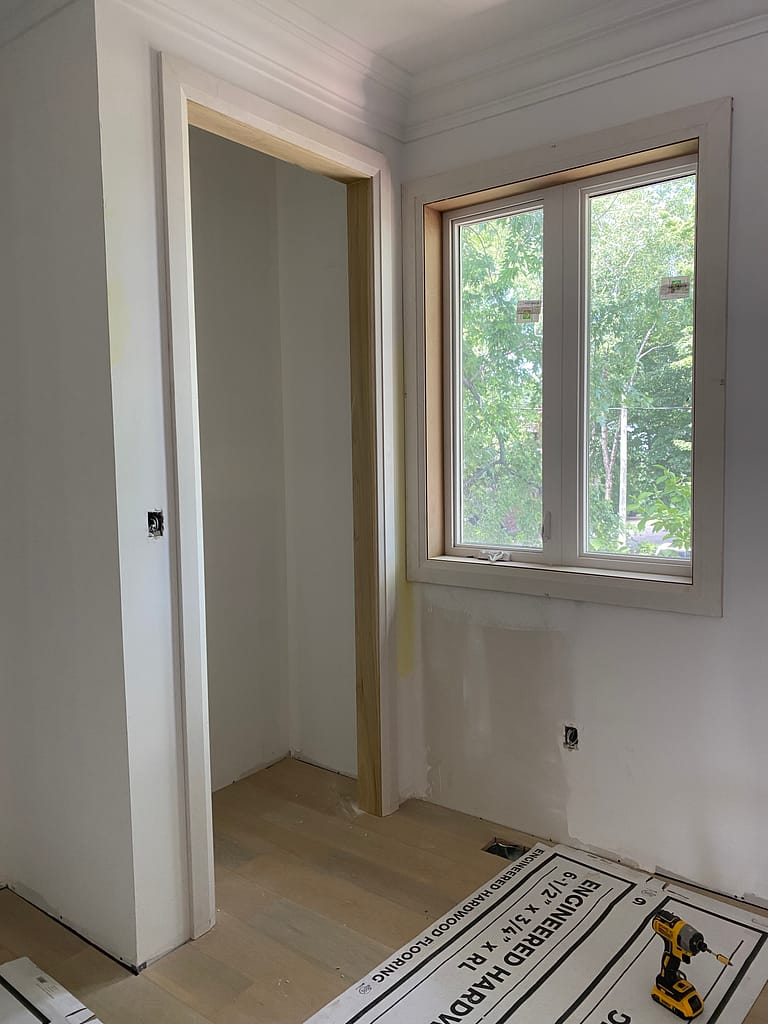 Door opening and window extension work before interior door installation in Oakville.