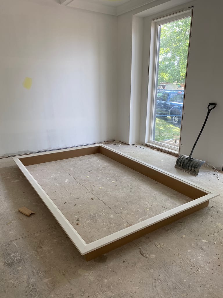 Window jamb extension and casing assembly prepared on the floor before installation in Oakville.