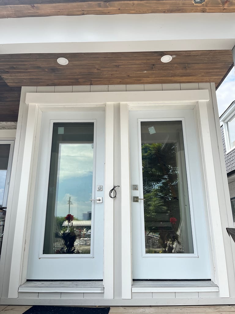 White PVC exterior trim installed around two glass doors in Port Credit