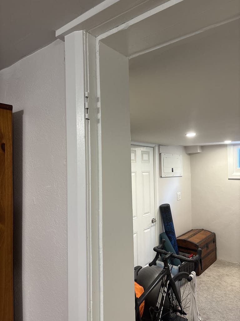 Existing uneven basement door opening in an older Kitchener home before installation