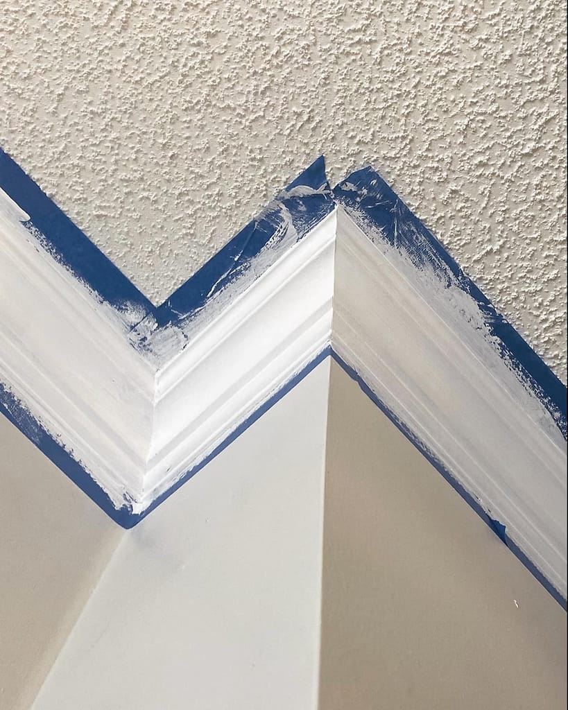 A detail of a crown molding trim installed by a finish carpenter