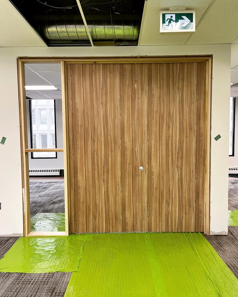 Commercial double doors installed by a finish carpenter in Mississauga