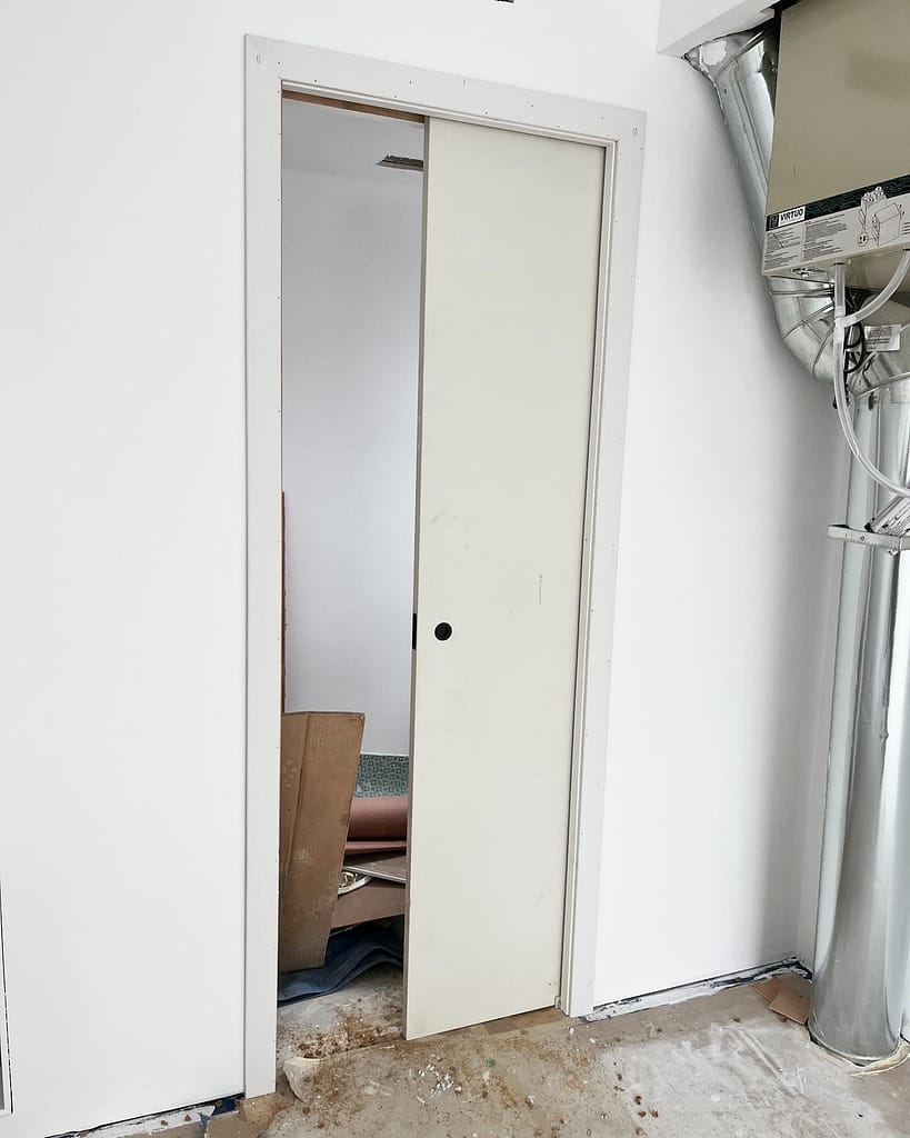 Pocket door installed within its frame by Wood Job Finish Carpentry