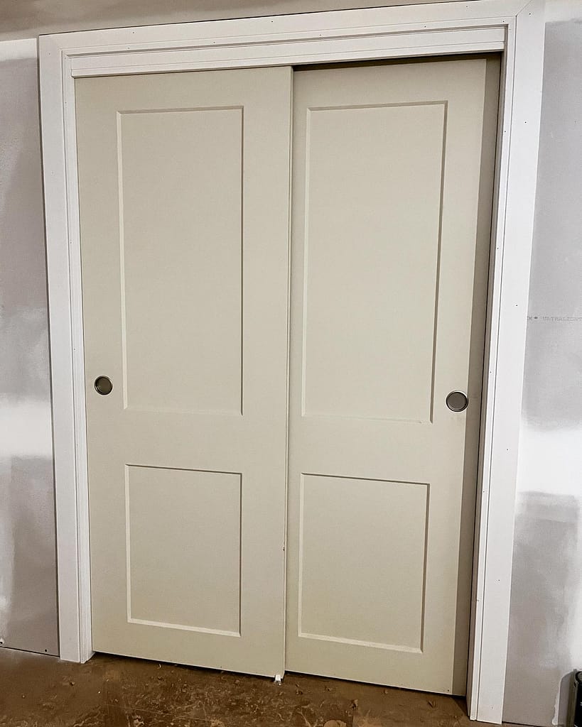 Closet doors installed with smooth operation and balanced reveal lines