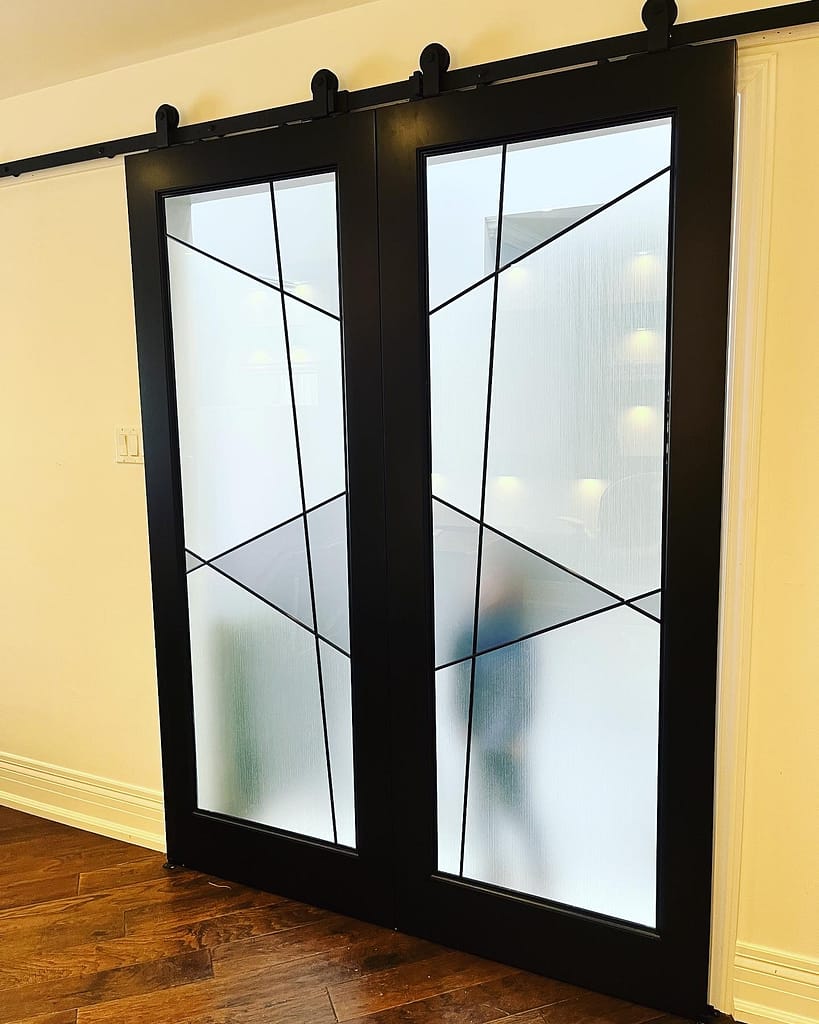 Custom barn door detail finished by Wood Job Finish Carpentry