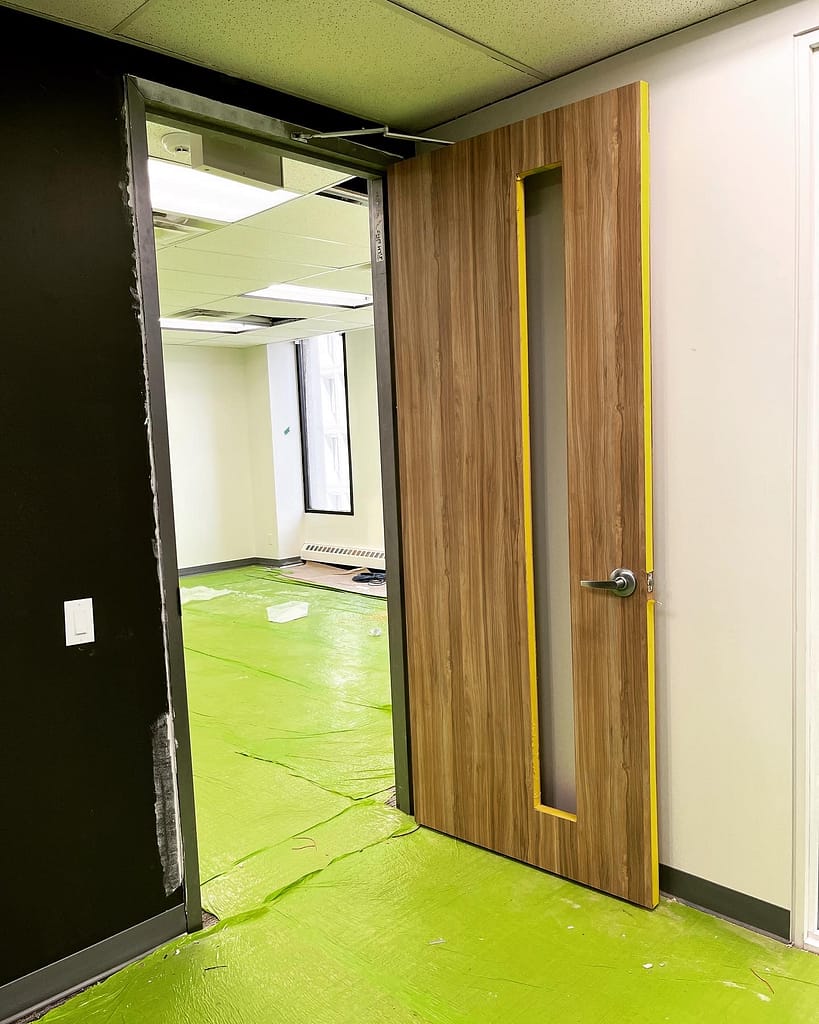 Commercial fire rated door installed by a finish carpenter in Mississauga.