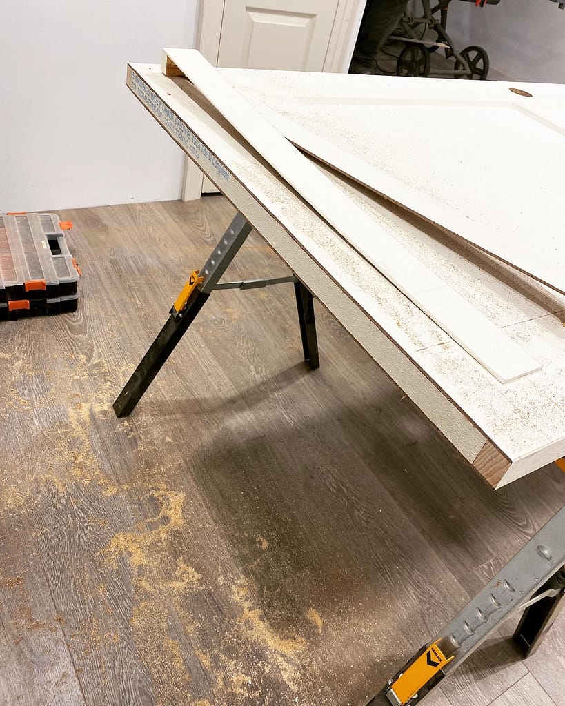 A pre-hung door resized by finish carpenter Jack in a basement renovation.