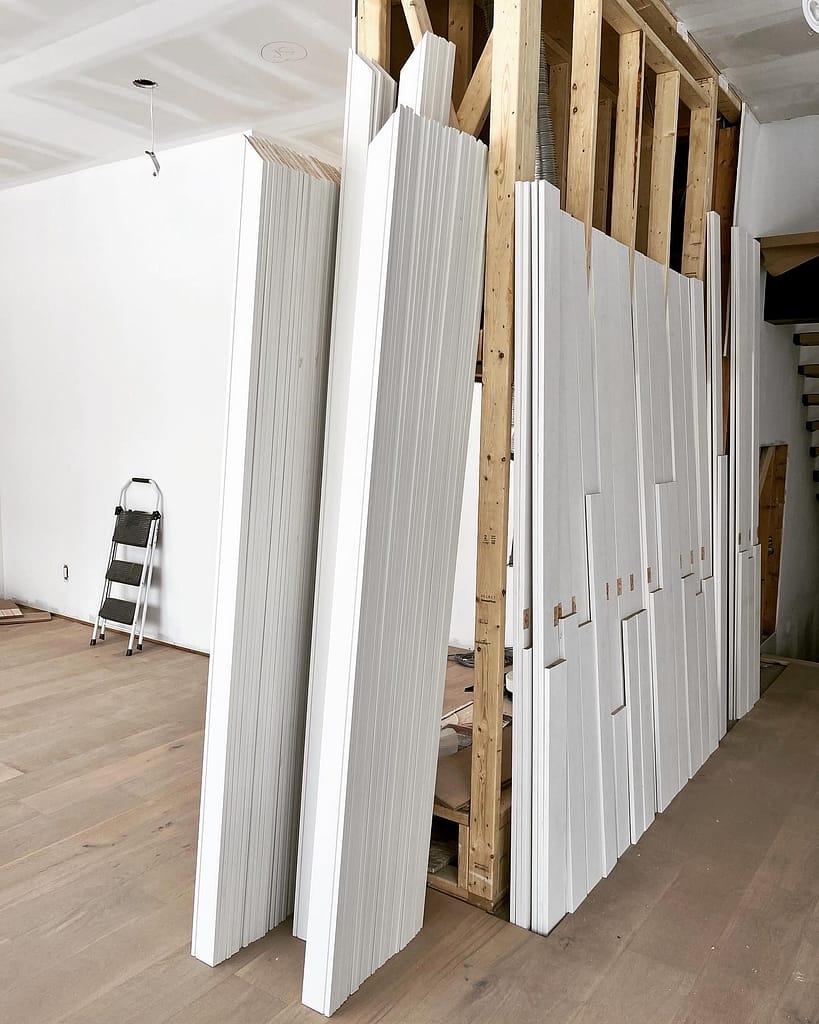 Door jambs and casings are prepared by a finish carpenter in Toronto house