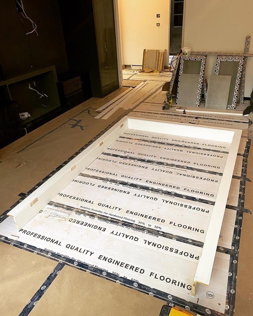 Custom interior door jamb and casing assembled on a protected floor during an Oakville door installation project.
