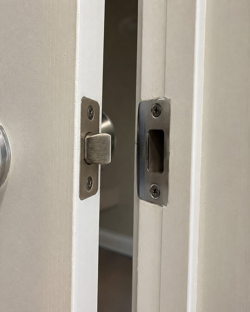 Interior door latch not lining up with the strike plate, causing the door to close without latching properly.