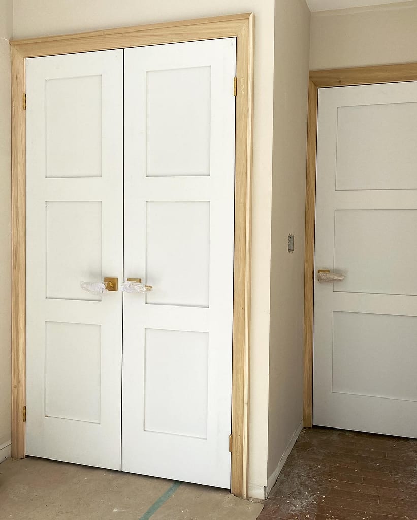 Two white doors installed by a finish carpenter in Milton.