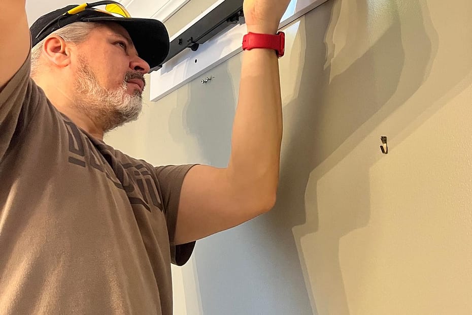 Jack Cenk Ozer working on a small finish carpentry project inside a home