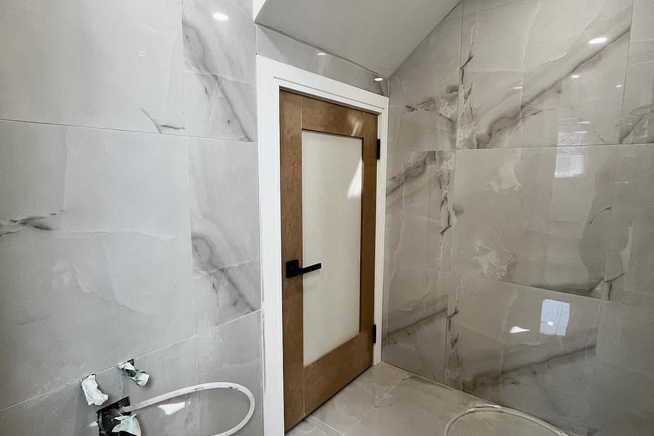 Why Custom Slab Doors Beat Pre-Hung Packages in Low-Clearance Basements carpentry