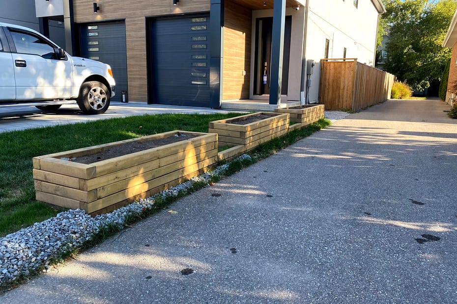 Sanded raised wooden planter boxes prepared for exterior stain in Mississauga
