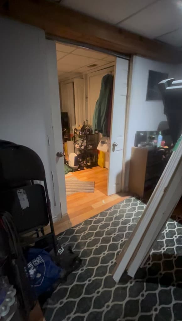 Misaligned and out of track sliding room passage doors in Luis's Mississauga home before removal and replacement.