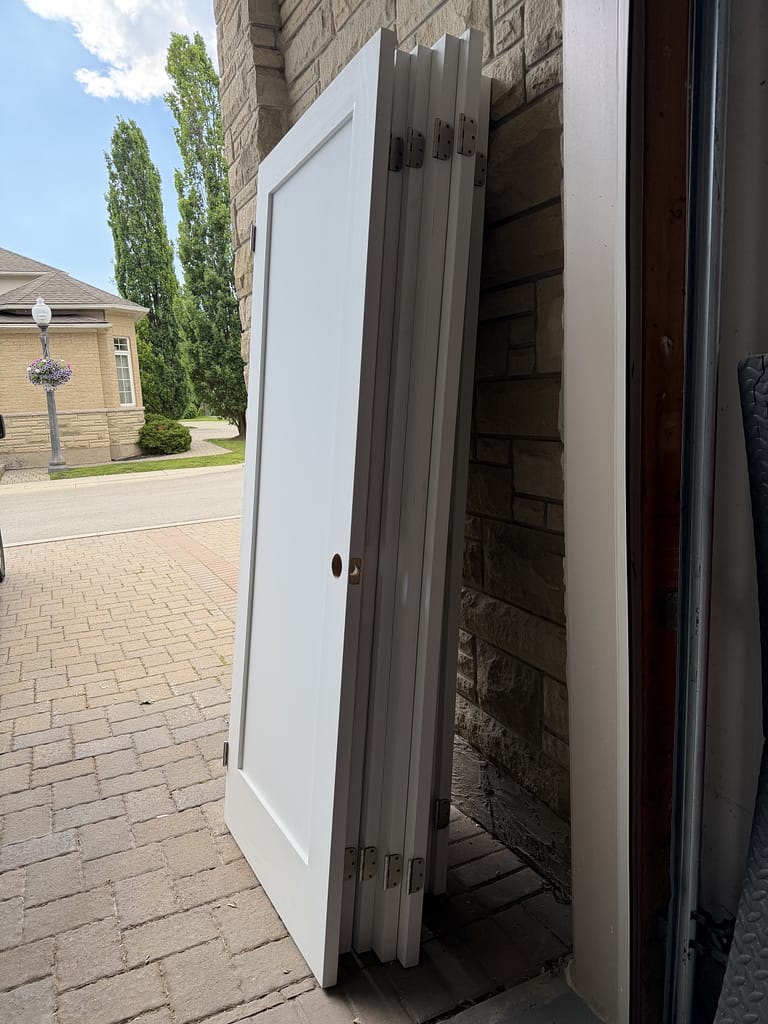One-panel shaker solid doors are prepared by finish carpenter Jack at Wood Job Finish Carpentry in Oakville.