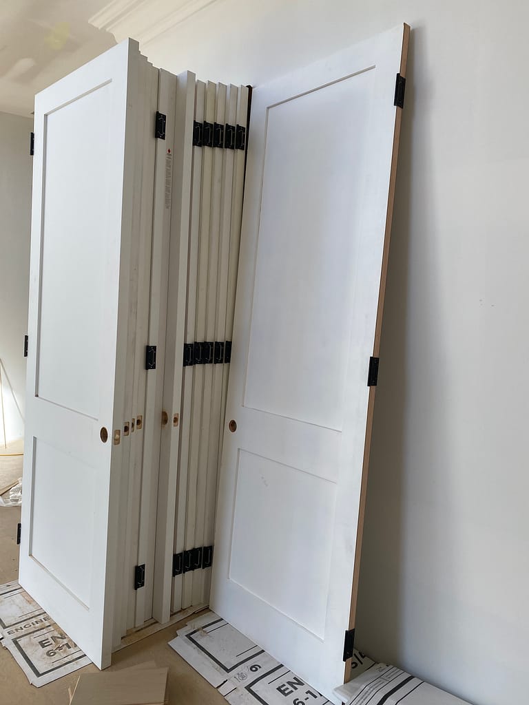96-inch solid-core one-panel shaker interior doors prepared for installation in an Oakville home.