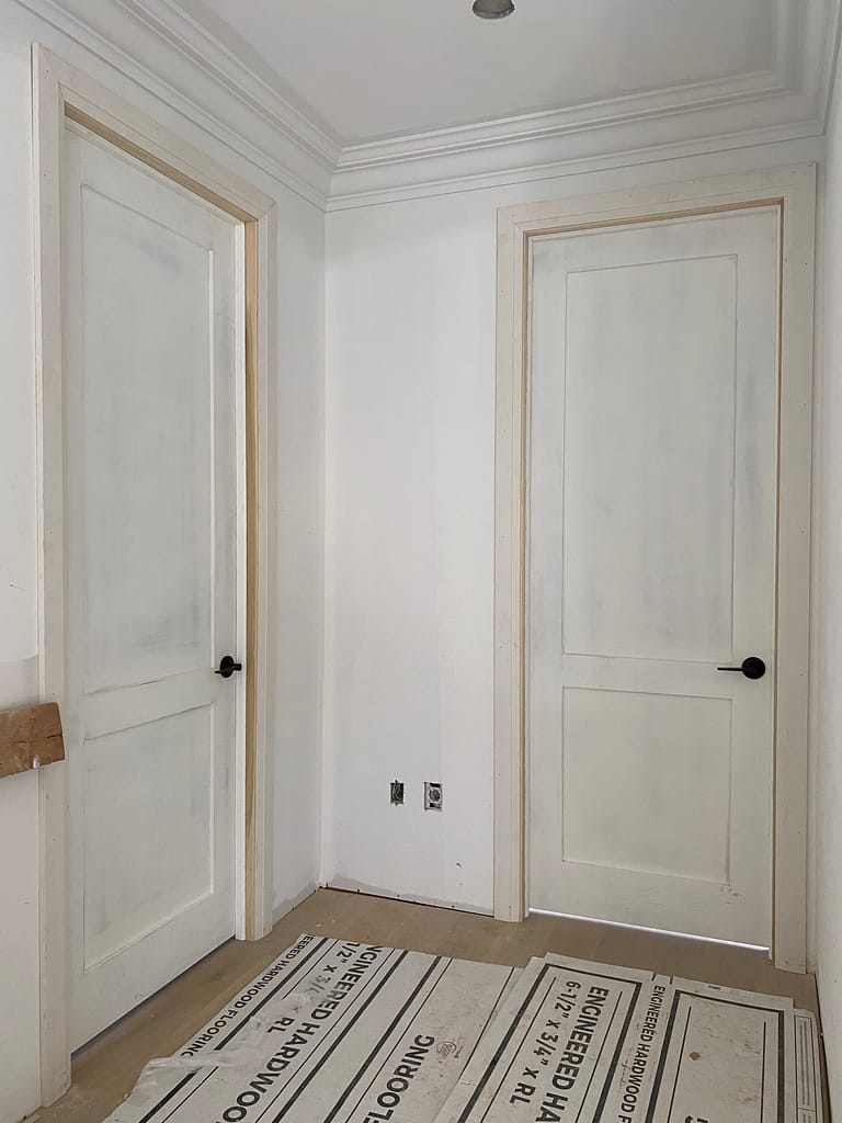 Two solid-core shaker doors with casing and trim installed in an Oakville home.