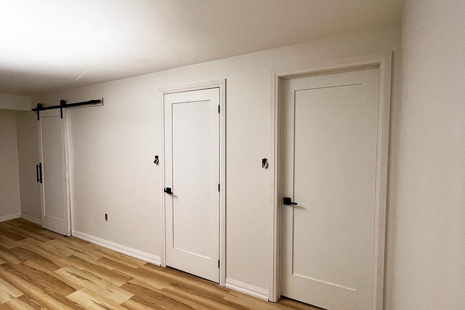 Vinyl Flooring, Doors and Trim Installation for a Bradford Basement Renovation carpentry