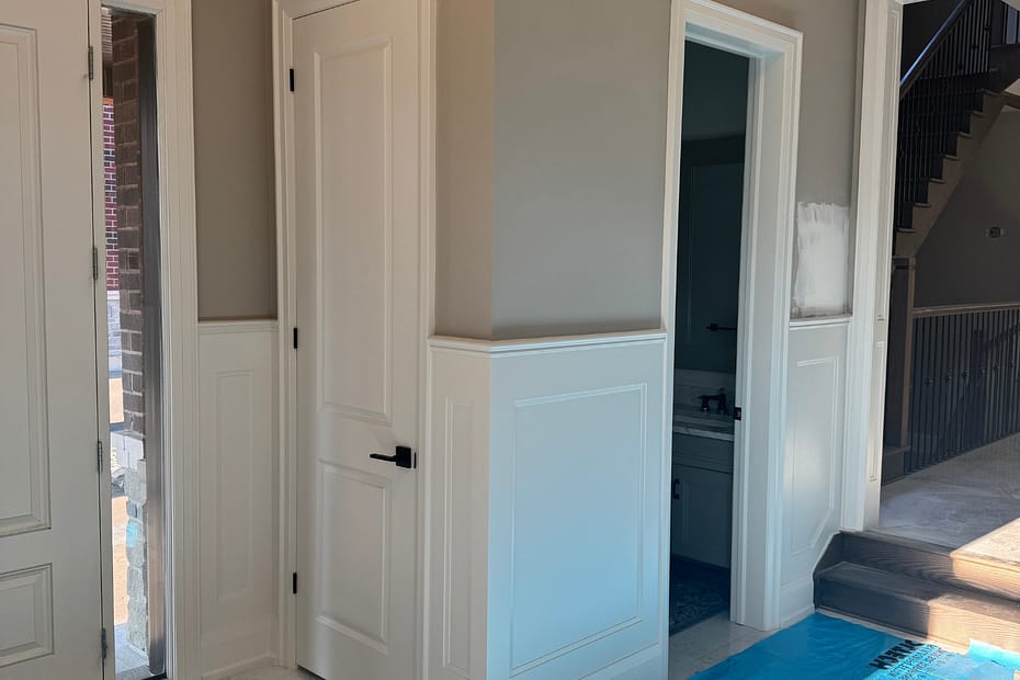 Foyer Wall Paneling and Archway Moulding in a Burlington Home carpentry
