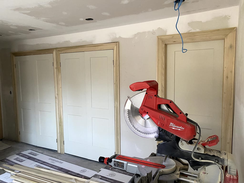 the finish carpenter setup for door and trim installation in Milton home