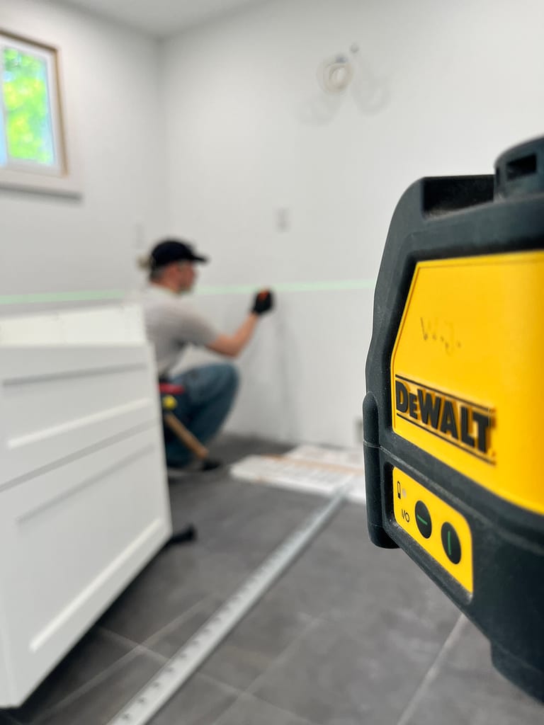 The finish carpenter Jack Cenk Ozer is working with DeWalt Laser Level in Oakville home project