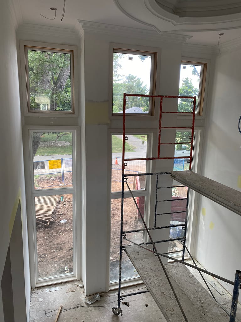a custom jamb and casing installed by a finish carpenter in an oversized window in Oakville home