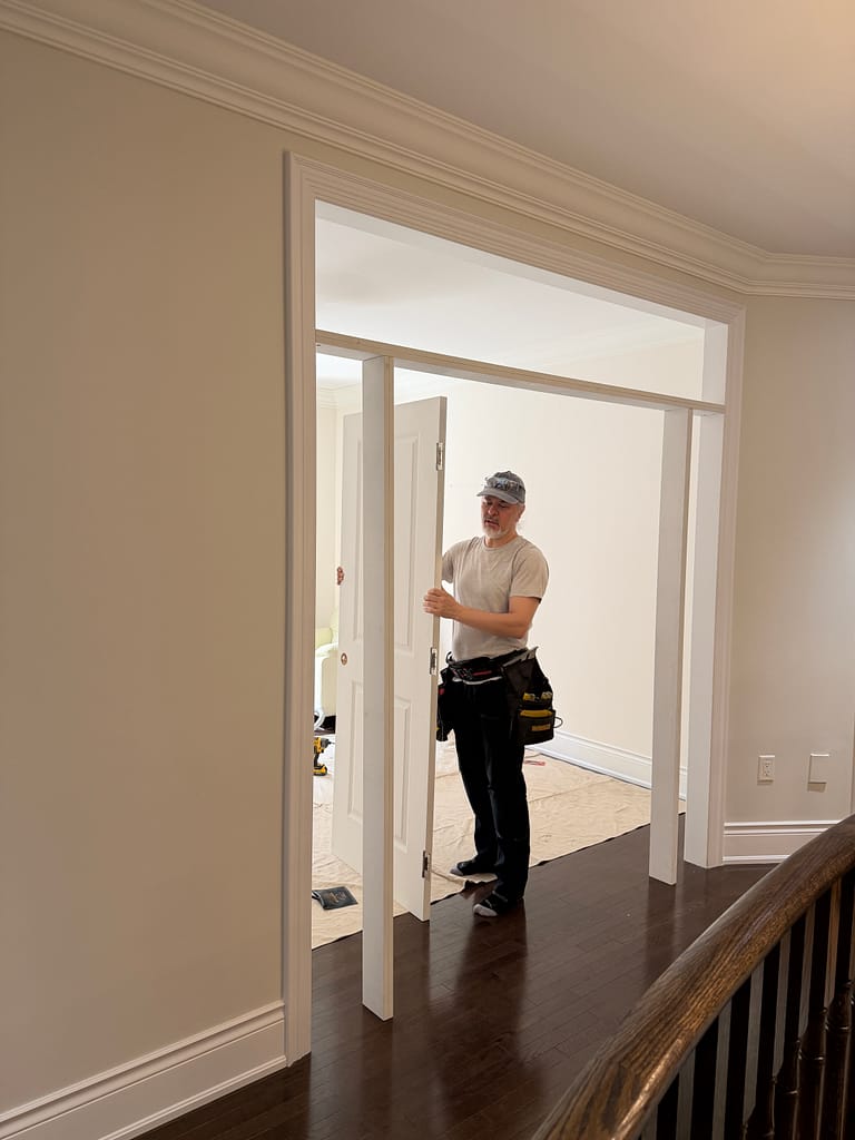 The finish carpenter in Vaughan installing a double door for home office.