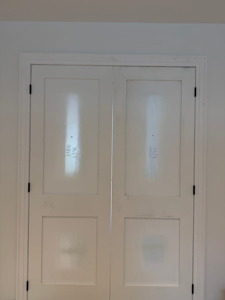 Glass double doors installed during a return visit for a Toronto door project