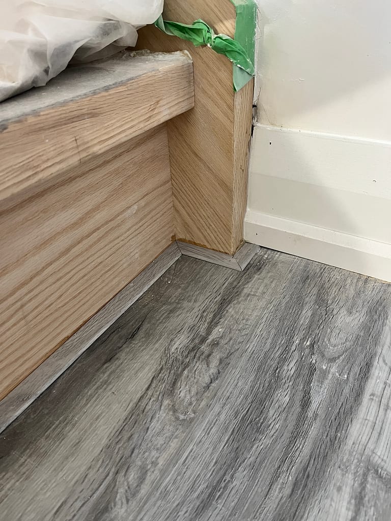 Finished vinyl flooring and baseboards transition in a Vaughan basement renovation