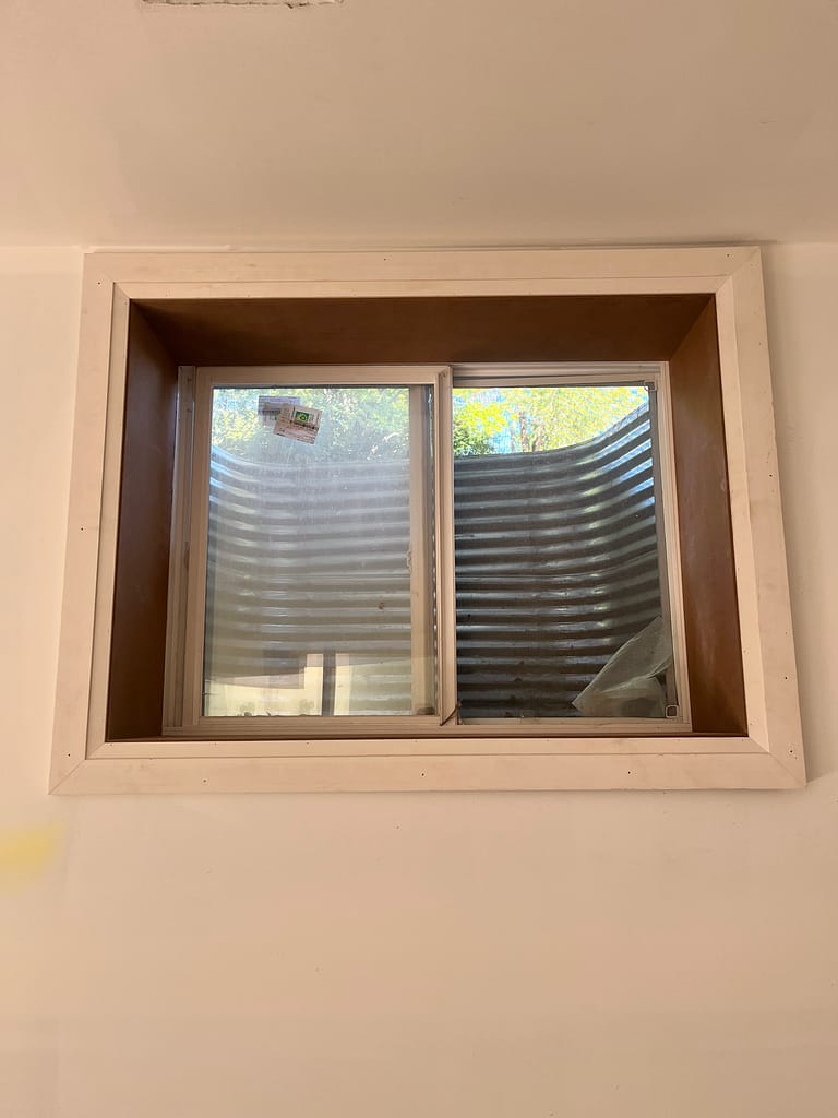 Window extension and casing are installed by a finish carpenter in Vaughan home.